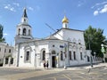 Moscow, Russia, June, 20, 2019. People walking near church of the Assumption of Blessed Virgin Mary Uspenskaya church in Pechat