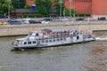 Moscow, Russia - June 19, 2018: Pleasure boat floating on Moskva river near Moscow Kremlin on a cloudy summer evening Royalty Free Stock Photo