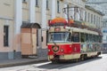 Retro tram carriage-restaurant Annushka on the historical city street.