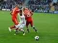 Igor Smolnikov and defensive midfielder Yury Gazinsky against Turkish midfielder Oguzhan Ozyakup