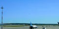 Moscow,Sheremetyevo international airport services.Aircraft standing in airfield,plane taking off.Sunny day,copy space Royalty Free Stock Photo