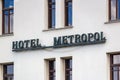 Moscow, Russia - June 02, 2019: Signboard Hotel Metropol on the white brick wall of building closeup