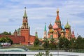 Moscow, Russia - June 21, 2018: St. Basils Cathedral on Red square and Spasskaya tower of Moscow Kremlin against Zaryadye Park at Royalty Free Stock Photo