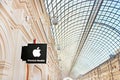 Transparent ceiling and lamps, signboard of APPLE PREMIUM RESELLER in GUM State Department Store, Moscow, Russia Royalty Free Stock Photo