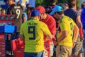 Moscow, Russia - June 28, 2018: Two fans of Colombian football team are next to the mobile tray with soft drinks