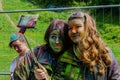 Moscow, Russia - June 3, 2017: Two stained with paints teenage girls make selfie after Holi festival expression
