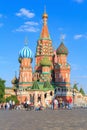 Moscow, Russia - June 28, 2018: Walking tourists near St. Basils Cathedral on Red square in Moscow on a sunny summer evening Royalty Free Stock Photo