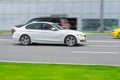 White BMW 3 Series F30 car moving on the street Royalty Free Stock Photo