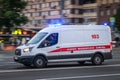 Moscow, Russia - June 16, 2019: White state ambulance minibus is moving along the wide and empty Moscow Avenue. Motion blur