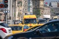 Yellow ambulance stands in a traffic jam. Traffic overload in Moscow. Moscow, Russia - June 16, 2019