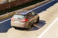 Hyundai IX35 in motion, rear side view. Aerial photography of a modern SUV car riding in Moscow streets