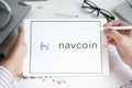 Moscow Russia 20.07.2021 Logo of Navcoin coin in mobile phone. Cryptocurrency NAV token. Trading blockchain platform to buy,sell