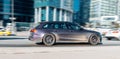 Audi S6 Avant car on the city road. Fast moving violet car on Moscow streets. Accelerating with low-emission. Compliance with