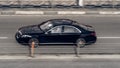 Black Mercedes S Class on the city road. Fast moving car on Moscow streets. Vehicle driving along the street in city with blurred Royalty Free Stock Photo