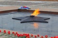 Moscow, Russia - March 22, 2018: Burning Eternal flame with red flowers in Victory Park on Poklonnaya Hill