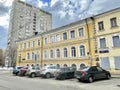 Moscow, Russia, March, 10, 2024. Cars are parked on the side of the road at house 9 built in 1898 on Shchepkina Street