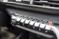 MOSCOW, RUSSIA - MARCH 15, 2020: Close-up of the control button on the center panel in the interior of the Blue SUV Peugeot 3008