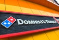 Moscow, Russia - March 21. 2019. Dominos pizza - USA international chain of fast food restaurants. Sign on wall of Royalty Free Stock Photo