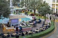 Moscow, Russia - March 7, 2020: Dream Island amusement park, square with fountain and resting place. People are resting in a cafe