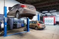 Moscow, Russia - March 19, 2020: Interior of auto repair workshop, car on lift in mechanic shop or garage, vehicles inside Royalty Free Stock Photo
