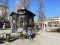 Moscow, Russia, March, 21, 2022. People relax in the Hermitage Garden next to a large, wrought-iron gazebo in the Hermitage Garden