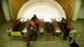 Moscow, Russia - March 5. 2016. People are riding on the escalator at Biblioteka imeni Lenina metro station