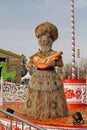 Straw Shrovetide doll with bird at Russian national festival `Shrove` in the park VDNKh in Moscow