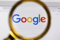 Moscow, Russia - 31 March 2021: View the Google homepage through a magnifier.