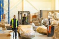 MOSCOW, RUSSIA - MARCH 18, 2021 Warehouse worker driving a forklift truck full of goods inside warehouse