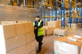 MOSCOW, RUSSIA - MARCH 18, 2021 Warehouse worker driving a forklift truck full of goods inside warehouse