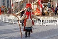 Woman dressed in vintage costume and scary mask at Russian national festival `Shrove` in Moscow