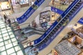 Moscow, Russia, 06/18/2020: Masked people on escalators in a large modern shopping center. Precautions during the coronavirus