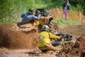 Athletes overcome a deep hole with water