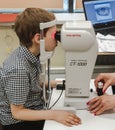 Moscow, Russia - May 20, 2019: A boy at an appointment with an ophthalmologist checks vision on the device. Child health