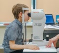 Moscow, Russia - May 20, 2019: A boy at an appointment with an ophthalmologist checks vision on the device. Child health