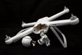 Moscow, Russia - May 13, 2019: Broken white Xiaomi Mi drone 4k after a fall. On a black background. Damaged body, motor and