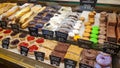 Moscow, Russia, May 17, 2020. Cakes on the shelves of a window of a street restaurant. Showcase of a pastry shop or cafe