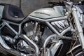 Moscow, Russia - May 04, 2019: Chrome engine with exhaust system pipes and glossy silver fuel tank with emblem of Harley Davidson