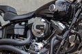 Moscow, Russia - May 04, 2019: Chromed engine with glossy black fuel tank and matte black exhaust system pipes of Harley Davidson