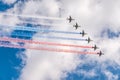 Moscow, Russia - May, 05, 2021: Eight attack aircrafts Su-25 fly with smoke, painted in the colors of the Russian flag. Parade in Royalty Free Stock Photo