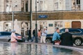 Moscow, Russia - MAY 28, 2018: Elderly retired male tourist takes a photo of his wife against the background of a