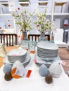 Moscow, Russia, May 2021: Elegant tableware is artfully displayed alongside festive Easter decorations, inviting shoppers to Royalty Free Stock Photo