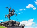 Equestrian statue of George the Victorious at the base of the Victory Monument stella. Sculptor Zurab Tsereteli`s project Royalty Free Stock Photo