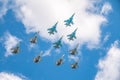 Moscow, Russia - May, 05, 2021: Fighters Su-35S and Su-30SM with bombers Su-34 in the blue sky over Red Square in the group Royalty Free Stock Photo