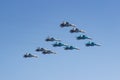 Moscow, Russia - May 07, 2019: Fighters Su-35S and Su-30SM with bombers Su-34 in the blue sky over Red Square in the group