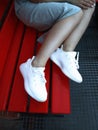 a girl in dress in white Adidas sneakers Yeezy boost 350 V2