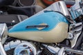 Moscow, Russia - May 04, 2019: Glossy blue fuel tank with Harley Davidson motorcycles emblem and chromed engine closeup. Moto