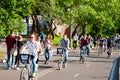 Gorky Central Park of Culture and Leisure full of locals, people ride bicycles.