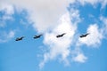 MOSCOW, RUSSIA - May 7, 2021: Group of Russian military tactical frontline bombers SU-24 fast flying in the blue sky on parade