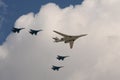 A group of SU-35S fighters and a Tu-160 supersonic long-range strategic bomber fly over Moscow`s Red Square during the dress rehea